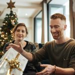 10 Best Outdoor Christmas Gifts for Men in 2026 Shot of young friends opening their Christmas gifts together at home
